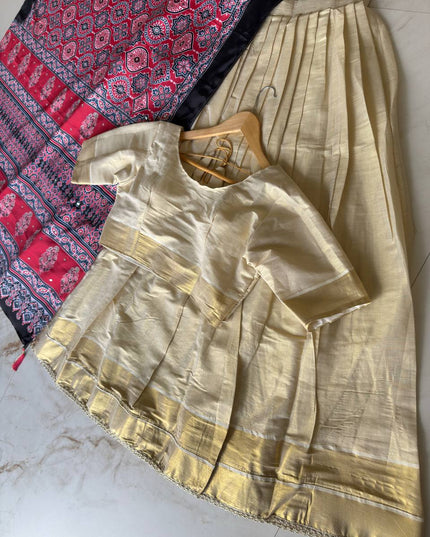 Onam Special Tissue Silk Gold Zari Half Saree Lehenga Choli with Ajrakh Print Dupatta | South Indian Style - Rosepetals Luxe