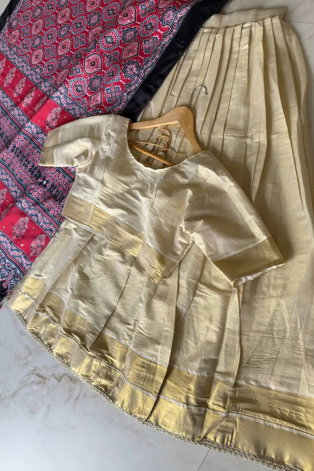 Onam Special Tissue Silk Gold Zari Half Saree Lehenga Choli with Ajrakh Print Dupatta | South Indian Style - Rosepetals Luxe